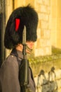 Extreme closeup of sentry at Tower of London in modern uniform