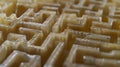 An extreme closeup of a small section of a waveguide showing the intricate network of tubes and channels. The tubes are
