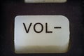 Extreme closeup of volume button on TV remote Royalty Free Stock Photo