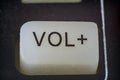 Extreme closeup of volume button on TV remote Royalty Free Stock Photo