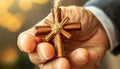 Wrinkled Hand of an Old Man Holding a Small Wooden Cross - Generative Ai Royalty Free Stock Photo