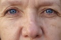 Extreme Cropped face of a blue-eyed middle-aged woman Royalty Free Stock Photo