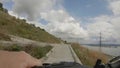 Extreme cycling on the high bank of a wide river