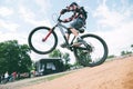 Extreme cycling. A man jumps on a bicycle. The teen does tricks on the bike