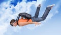 Extreme flight man with a parachute in the clouds