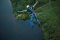 Extreme jump from the bridge. The man jumps surprisingly quickly in bungee jumping at Sky Park explores extreme fun. Bungee in the