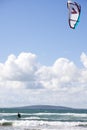 Extreme kite surfer on fast surf