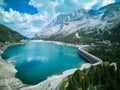 Extreme long shot of the Fedaia Pass, over Fedaia Lake, Dolomites, and the Marmolada glacier Royalty Free Stock Photo