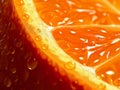 Extreme macro illustration of piece of orange in zoom. Water droplets are on the orange.