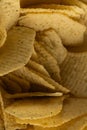 Extreme Macro Texture of Ruffled Potato Chips with Green Seasoning Royalty Free Stock Photo