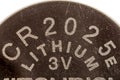 Upper part of a Lithium button cell  Battery Royalty Free Stock Photo
