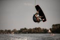 extreme man doing jump and somersault over splashing water on wakeboard Royalty Free Stock Photo