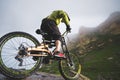 Extreme mountain bike sports athlete man in helmet riding outdoors against a background of rocks. Lifestyle. Trial Royalty Free Stock Photo