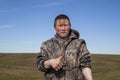 The extreme north, Yamal, the preparation of deer meat, the male reindeer breeder eats fresh meat, venison