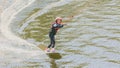 Extreme Park, Kiev, Ukraine, 07 may 2017 - a little girl to ride a Wakeboard. Photo of grain processing Royalty Free Stock Photo