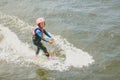 Extreme Park, Kiev, Ukraine, 07 may 2017 - a little girl to ride a Wakeboard. Photo of grain processing Royalty Free Stock Photo