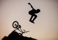 Extreme rider falling while performing making a bike jump. Royalty Free Stock Photo