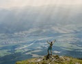 Extreme runner finally climbs the mountain top and see wide valley Royalty Free Stock Photo
