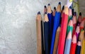 Extreme shallow of depth. Bunch of colorful pencils kept against white designer background Royalty Free Stock Photo