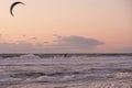 Extreme Sport Kitesurfing, cargo ships on the horizon. Surfer in the sea at Scheveningen at sunset