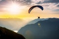 Extreme sport, a man flies on a paraglider over the mountains. Generative ai Royalty Free Stock Photo