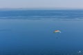 Paragliding over a dreamy blue sea