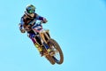 Extreme sports, motorcycle jumping. Motorcyclist makes an extreme jump against the sky. Royalty Free Stock Photo