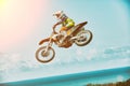 Extreme sports, motorcycle jumping. Motorcyclist makes an extreme jump against the sky. Extreme sports, motorcycle
