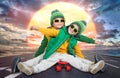 Two brothers ride a skateboard.Extreme sports. Royalty Free Stock Photo