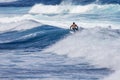 Extreme surfer riding giant ocean wave in Hawaii Royalty Free Stock Photo