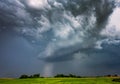 Extreme thunderstorm supercell with white hail core, hail falling on a village
