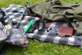 Things hunter on the grass. A necessary set of items for natural extreme travel.