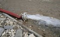 Extreme weather - water being pumped out of a flooded basement