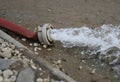 Extreme weather - water being pumped out of a flooded basement