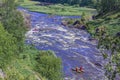 Extreme whitewater rafting trip. A group of people team in sport ÃÂatamarans practise traversing the water rapids of the Royalty Free Stock Photo