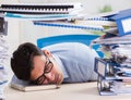 Extremely busy businessman working in office Royalty Free Stock Photo