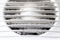 Extremely dirty and dusty white plastic ventilation air grille at home close up, harmful for health
