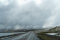 Extremely foggy and cloudy arctic, wet slippery road conditions along a high mountain pass in Iceland Royalty Free Stock Photo