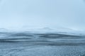 Extremely foggy, cloudy snow storm, during summer, wet slippery road conditions along a high mountain pass in Iceland Royalty Free Stock Photo