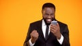 Extremely Happy African-american Man Holding Phone And Making Yes Gesture, Win