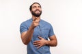 Extremely happy bearded man laughing holding hand on belly and pointing finger at you looking at camera, funny ridiculous joke