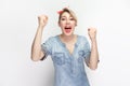 Extremely happy cheerful woman standing clenched fists, celebrating victory. Royalty Free Stock Photo