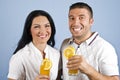 Extremely happy couple with orange juice Royalty Free Stock Photo