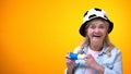 Extremely happy old lady supporting football team, sport betting, active life Royalty Free Stock Photo