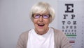 Extremely happy retired woman enjoying perfect eye sight in new glasses, health Royalty Free Stock Photo