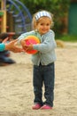 Extremely happy toddler girl who at last has caught the ball Royalty Free Stock Photo