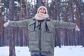 Extremely happy woman rejoices nice wintry weather in the forest Royalty Free Stock Photo