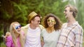 Extremely happy young people laughing at joke, close friends meeting outdoors