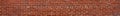 Extremely long thin panorama of red brick wall with irregular bricks in running bond pattern Royalty Free Stock Photo