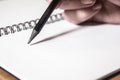 Extremly close-up of man hand with pen writing on notebook. education concept Royalty Free Stock Photo